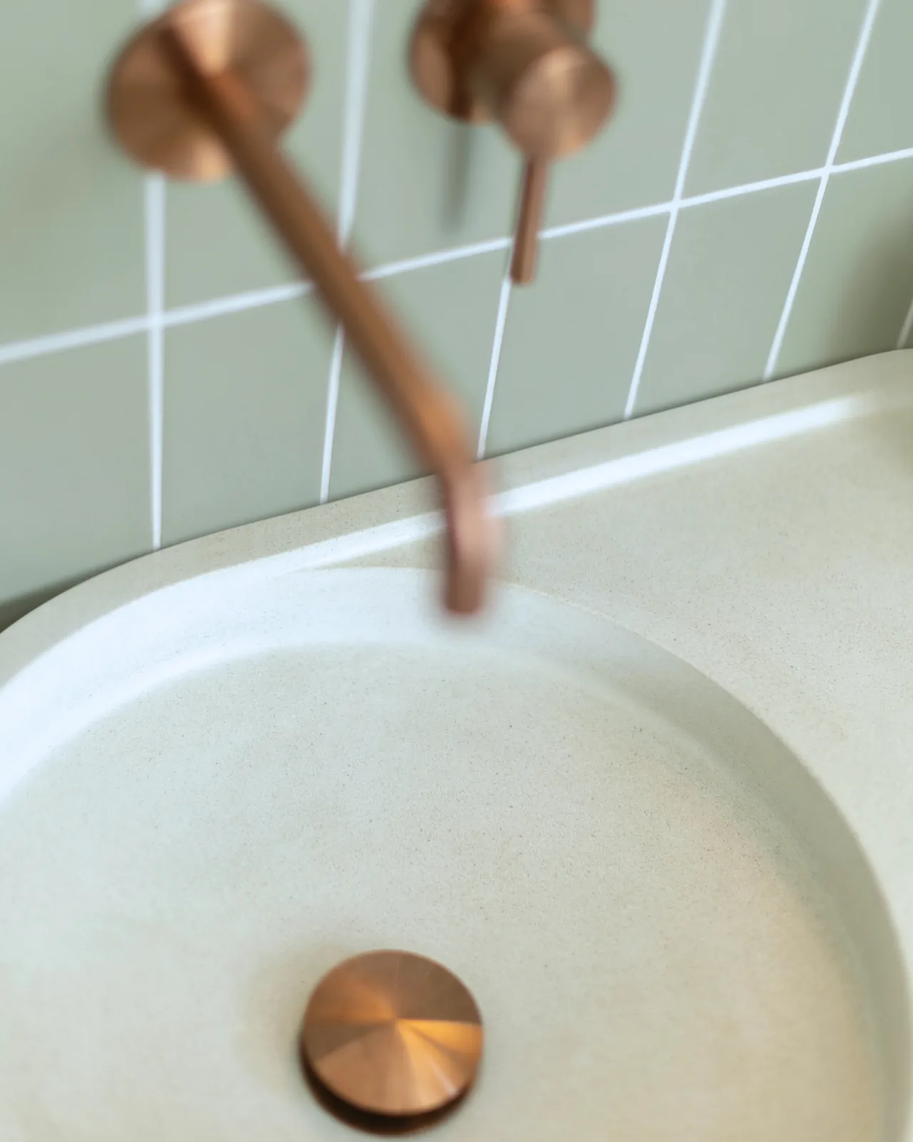 Close view of the Daphne basin's soft rounded bowl and copper waste