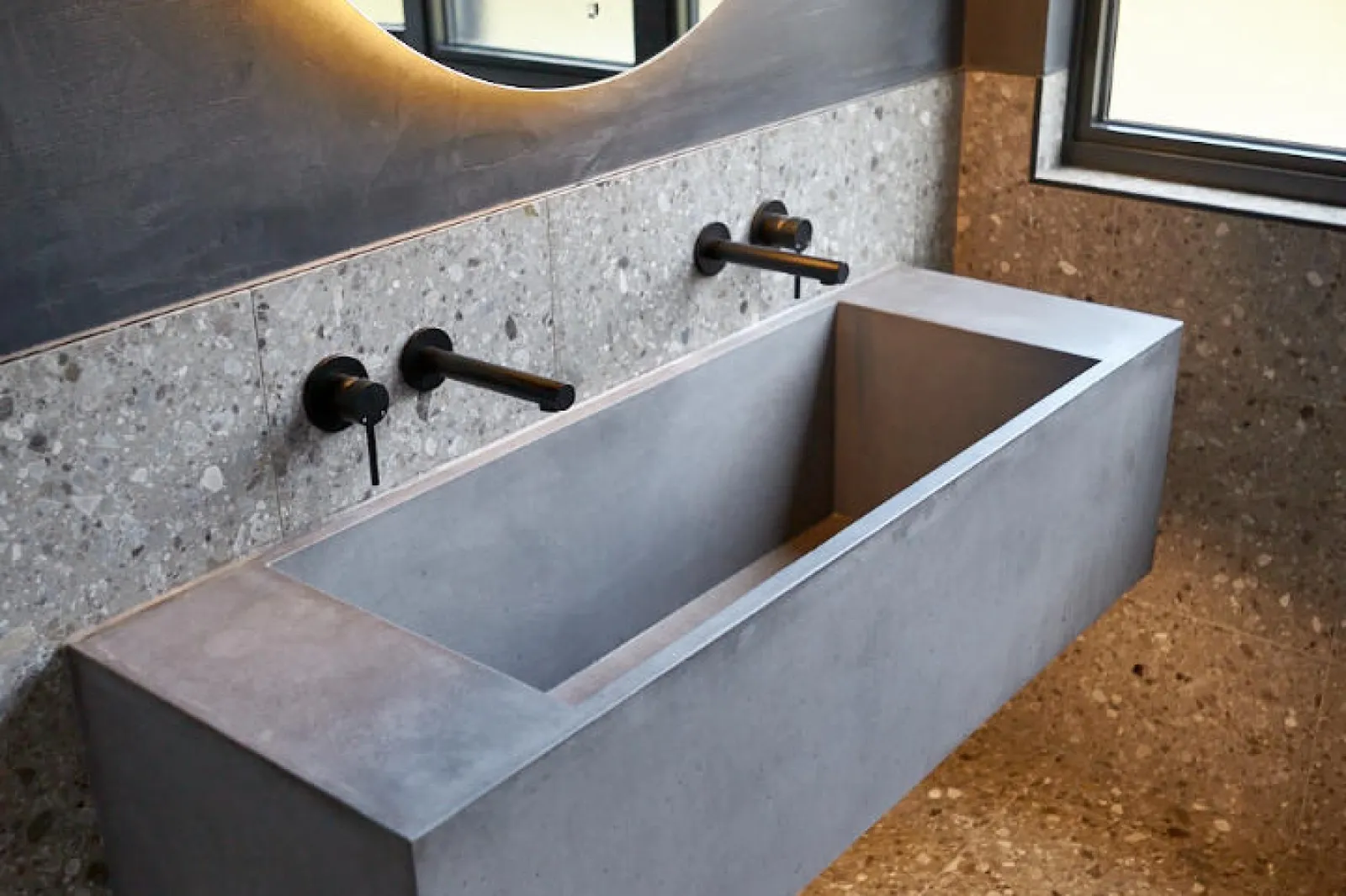 A W+R trough basin on terrazzo, from a W+R project